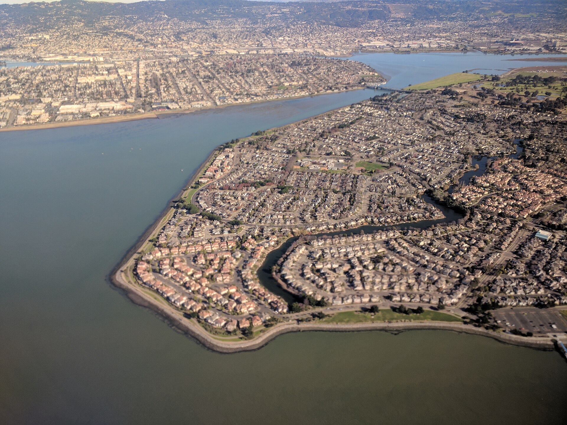 Aerial view of a neighbourhood of houses along a bay in California