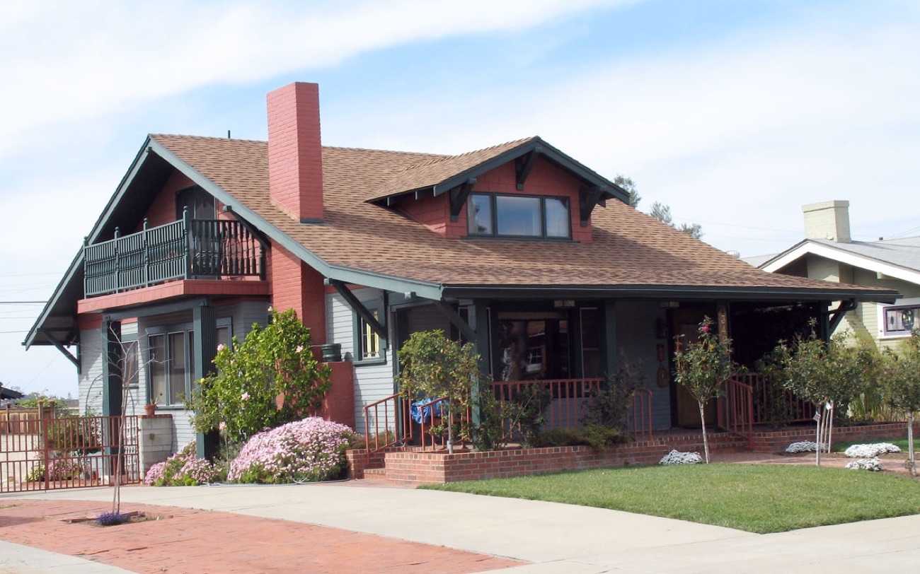 A Craftsman bungalow with a brick porch, the kind of house that is rented out